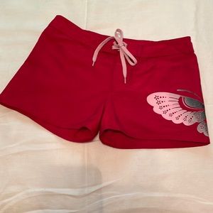 Roxie Girl board shorts, red with pink butterfly. Sz. 14.